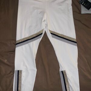 Nike Women's White Track Pants with Black and Gold Accents